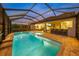 Stunning screened-in pool and spa with brick pavers and a built-in bar area, perfect for entertaining at 11422 Apple Tree Cir, Bradenton, FL 34211