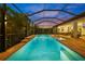 Inviting screened-in pool and spa with brick pavers and ample seating for outdoor relaxation at 11422 Apple Tree Cir, Bradenton, FL 34211