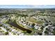 Aerial view of community with houses surrounding two tranquil ponds at 11839 Shrewsbury Ln, Parrish, FL 34219