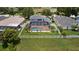 Stunning backyard showcasing a sparkling screened pool, well-manicured lawn, and private fenced-in yard with water views at 11839 Shrewsbury Ln, Parrish, FL 34219