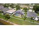 Wonderful backyard featuring a screened pool with water views and white fencing creating a serene oasis at 11839 Shrewsbury Ln, Parrish, FL 34219