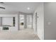 Open bonus room with neutral walls has a plant and built-in bookcase at 11839 Shrewsbury Ln, Parrish, FL 34219