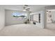 This spacious bonus room has a large window and a built-in bookcase for plenty of storage at 11839 Shrewsbury Ln, Parrish, FL 34219