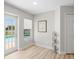 Bright dining area features a door to the pool, a window, neutral colors, and light wood floors at 11839 Shrewsbury Ln, Parrish, FL 34219
