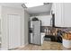 Well-equipped kitchen features stainless steel appliances, granite countertops, and white cabinetry at 11839 Shrewsbury Ln, Parrish, FL 34219
