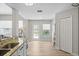 Bright kitchen with granite counters and view to the outdoor pool at 11839 Shrewsbury Ln, Parrish, FL 34219