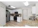 Modern kitchen with stainless steel appliances, granite counters, and ample cabinet space at 11839 Shrewsbury Ln, Parrish, FL 34219