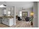 Open-concept living room showcases modern design elements, flowing from kitchen at 11839 Shrewsbury Ln, Parrish, FL 34219