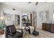 Inviting living room features stylish furniture, wood floors, and open access to kitchen area at 11839 Shrewsbury Ln, Parrish, FL 34219