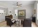 Cozy living area with light wood floors, comfortable armchairs, decorative accents, and natural light at 11839 Shrewsbury Ln, Parrish, FL 34219