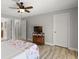 This neutral main bedroom has a ceiling fan and plenty of storage in a wood cabinet at 11839 Shrewsbury Ln, Parrish, FL 34219