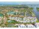 Aerial view highlighting this waterfront community with pool, tennis courts, and boat access at 1240 Siesta Bayside Dr # 1240C, Sarasota, FL 34242