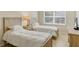 Inviting bedroom with twin beds, soft lighting, and a serene atmosphere, perfect for relaxation at 1240 Siesta Bayside Dr # 1240C, Sarasota, FL 34242