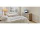 Comfortable bedroom featuring twin beds, bright natural light, and warm, inviting textures at 1240 Siesta Bayside Dr # 1240C, Sarasota, FL 34242
