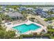 Aerial view of community pool and recreation area, surrounded by lush landscaping at 1240 Siesta Bayside Dr # 1240C, Sarasota, FL 34242