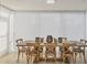 Elegant dining room with a large table, seating for eight, and ample natural light at 1240 Siesta Bayside Dr # 1240C, Sarasota, FL 34242