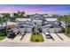 Charming townhome with a two-car garage, lush landscaping, and a metal roof in a desirable community at 1240 Siesta Bayside Dr # 1240C, Sarasota, FL 34242