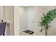 Bright foyer with a white door, neutral walls, and elegant flooring, creating a welcoming entrance at 1240 Siesta Bayside Dr # 1240C, Sarasota, FL 34242