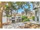 Outdoor grilling area with picnic tables and modern grills, ideal for hosting gatherings and enjoying outdoor meals at 1240 Siesta Bayside Dr # 1240C, Sarasota, FL 34242