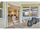 Open-concept living area flowing into the kitchen, featuring modern furnishings and abundant natural light at 1240 Siesta Bayside Dr # 1240C, Sarasota, FL 34242