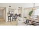 Open-concept living room with bar seating, modern lighting, and neutral color palette at 1240 Siesta Bayside Dr # 1240C, Sarasota, FL 34242