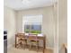 Bright office space with a desk, chairs, and a window overlooking the exterior at 1240 Siesta Bayside Dr # 1240C, Sarasota, FL 34242