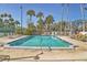Community pool, offering a relaxing retreat for residents with lounge chairs and clear, inviting waters on a sunny day at 1240 Siesta Bayside Dr # 1240C, Sarasota, FL 34242