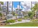Charming community sign amidst lush landscaping at Gulf & Bay Club Bayside at 1240 Siesta Bayside Dr # 1240C, Sarasota, FL 34242