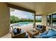 Relaxing back porch with comfortable outdoor seating overlooking a private pool and landscaped yard at 12814 Daisy Pl, Bradenton, FL 34212