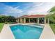 Wide view of the pool and spa with ample patio space for entertainment at 12814 Daisy Pl, Bradenton, FL 34212