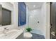 Modern bathroom showcasing a glass shower, unique tile, and updated fixtures at 12814 Daisy Pl, Bradenton, FL 34212