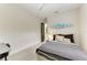 Bedroom with modern furnishings and decor with a cool surfboard wall decoration at 12814 Daisy Pl, Bradenton, FL 34212