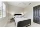 Cozy bedroom with gray color scheme, sleek design, and minimalist style at 12814 Daisy Pl, Bradenton, FL 34212