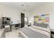 A bedroom with a custom headboard made of vintage license plates and a desk at 12814 Daisy Pl, Bradenton, FL 34212
