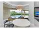 Cozy dining area with views of the pool and outdoor seating at 12814 Daisy Pl, Bradenton, FL 34212