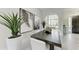 Elegant dining area with stylish decor, contemporary furniture, and bright natural light at 12814 Daisy Pl, Bradenton, FL 34212
