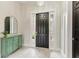 Welcoming foyer showcasing a stylish front door, modern decor, and elegant flooring at 12814 Daisy Pl, Bradenton, FL 34212