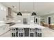 Bright, modern kitchen with large island, stainless steel appliances, and ample cabinet space at 12814 Daisy Pl, Bradenton, FL 34212