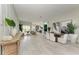 Spacious open-concept living area featuring sleek floors, modern furnishings, and ample natural light at 12814 Daisy Pl, Bradenton, FL 34212