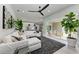 Bright living room with open concept to the kitchen and sliding doors to the outdoor area at 12814 Daisy Pl, Bradenton, FL 34212