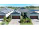 Beautiful home with a two-car garage, surrounded by picturesque water views and lush landscaping at 12827 Lily Quartz Loop, Parrish, FL 34219