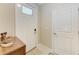 Clean, bright front door featuring modern hardware and a warm, welcoming atmosphere at 12827 Lily Quartz Loop, Parrish, FL 34219