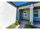Inviting front entrance with a charming brick pathway and a well-maintained exterior at 12827 Lily Quartz Loop, Parrish, FL 34219