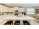 Spacious kitchen featuring a large center island, stainless steel appliances, and ample cabinet space at 12827 Lily Quartz Loop, Parrish, FL 34219