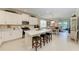 Open-concept kitchen flows into the dining and living areas, perfect for entertaining at 12827 Lily Quartz Loop, Parrish, FL 34219