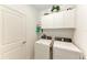 Clean laundry room featuring a modern washer and dryer at 12827 Lily Quartz Loop, Parrish, FL 34219