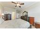 The main bedroom features elegant furnishings, including dressers, bedside tables, and a comfortable bed at 12827 Lily Quartz Loop, Parrish, FL 34219