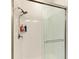Modern shower with white subway tile surround, glass doors, and sleek fixtures providing a spa-like experience at 12827 Lily Quartz Loop, Parrish, FL 34219