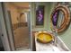 Modern bathroom featuring decorative sink basin, vanity with drawers, and glass-door shower at 1308 63Rd Nw St, Bradenton, FL 34209