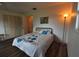 Cozy bedroom with hardwood floors, closet, and bright lighting at 1308 63Rd Nw St, Bradenton, FL 34209